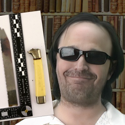 Smirking man with dark hair, scruffy facial hair, and sunglasses with an inset photo of a knife blade and knife handle with a scale to show their size